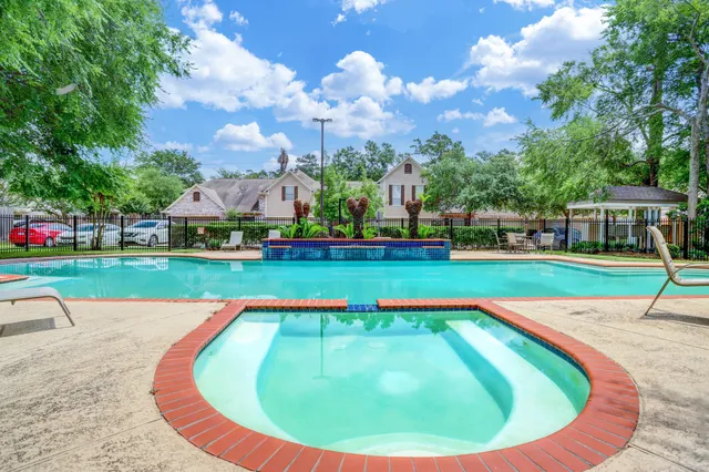 a view of a swimming pool with an outdoor space and seating area