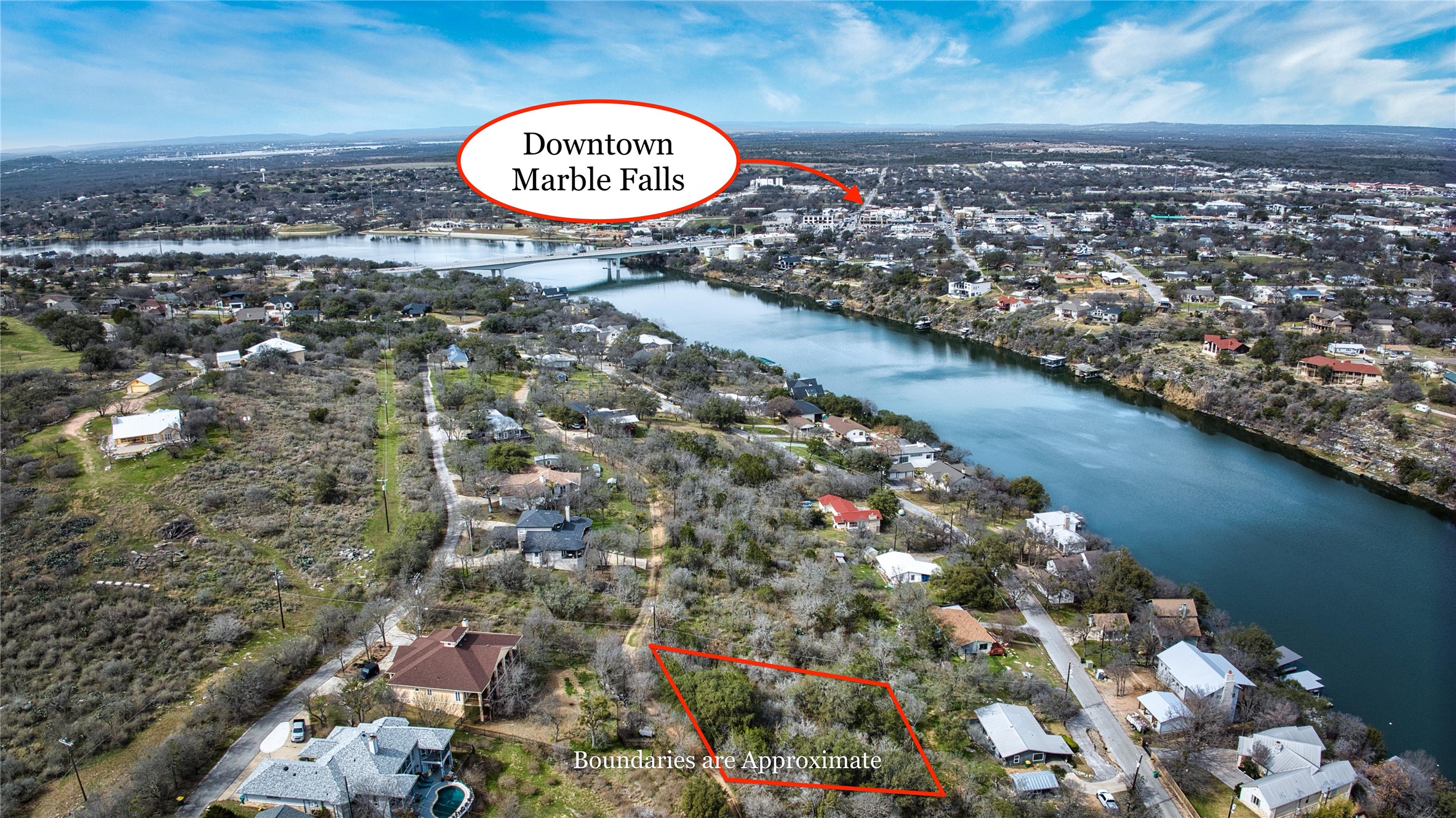 0 Uno Street Marble Falls, TX 78654 - Photo 11 of 25 Aerial perspective of suburban area with a nearby body of water and property parcel outlined