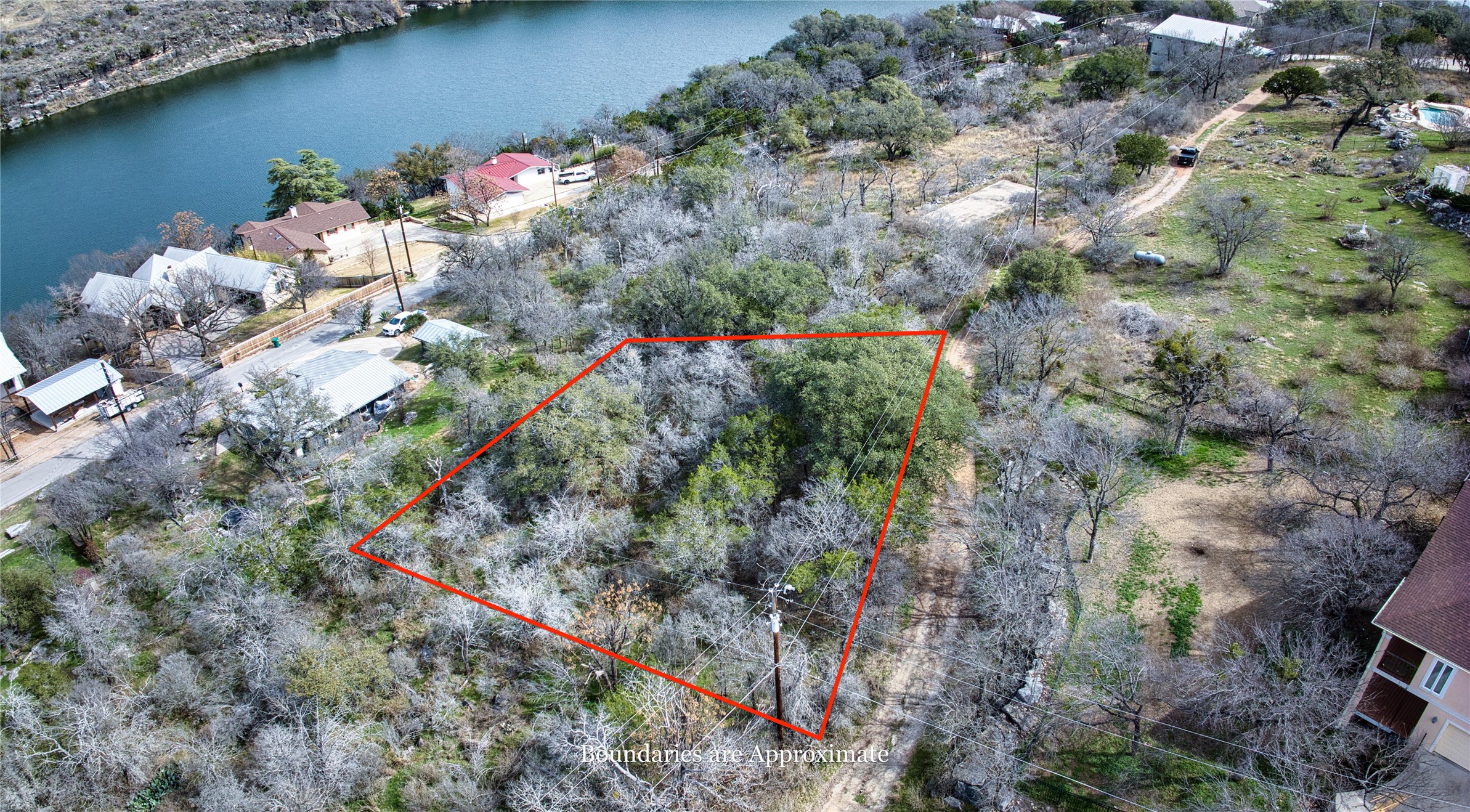 0 Uno Street Marble Falls, TX 78654 - Photo 18 of 25 Aerial view of property's location featuring a nearby body of water and property boundaries highlighted