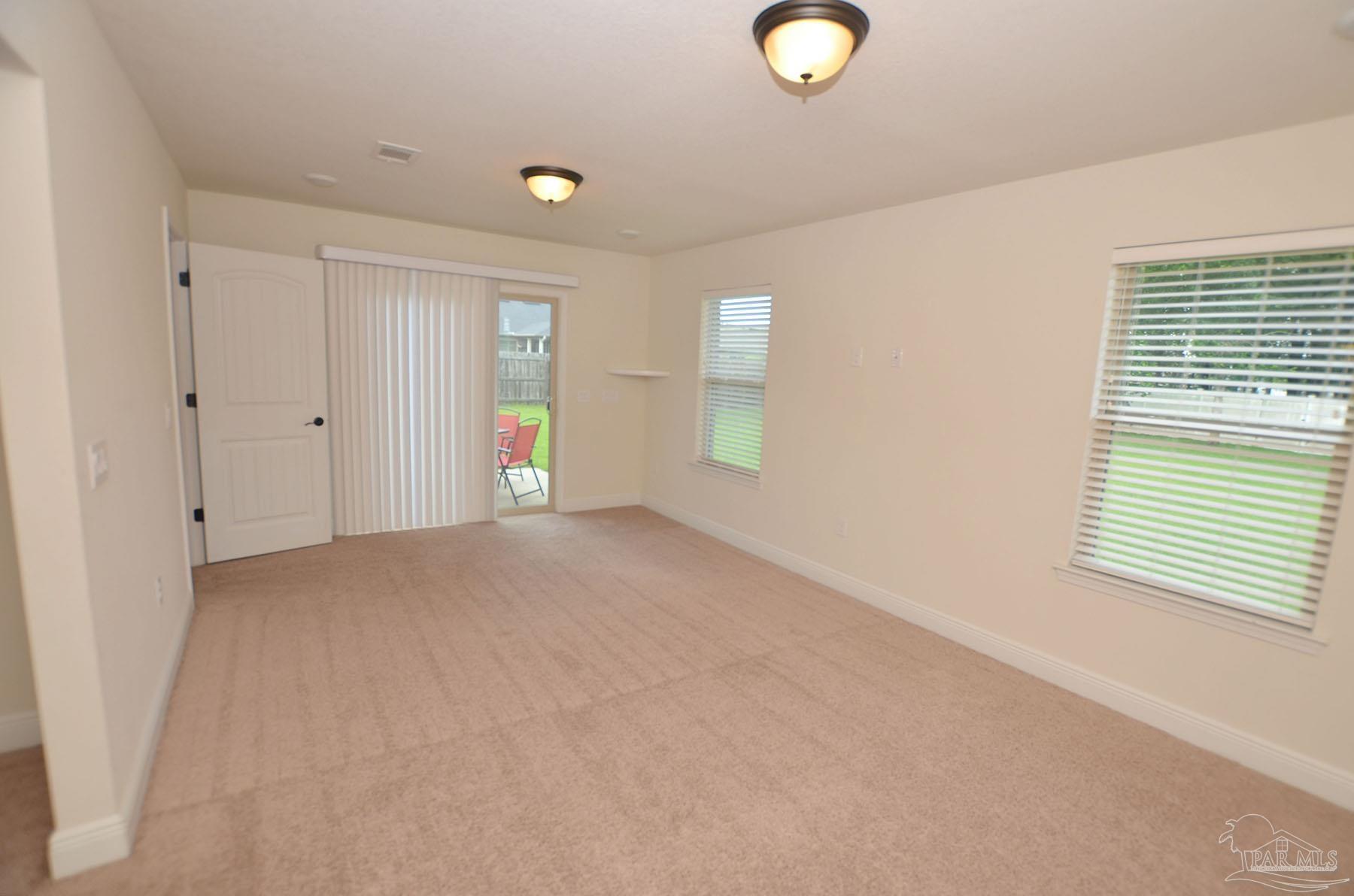5709 Mill Stream Way Pace, FL 32571 - Photo 30 of 48 a view of an empty room with a window