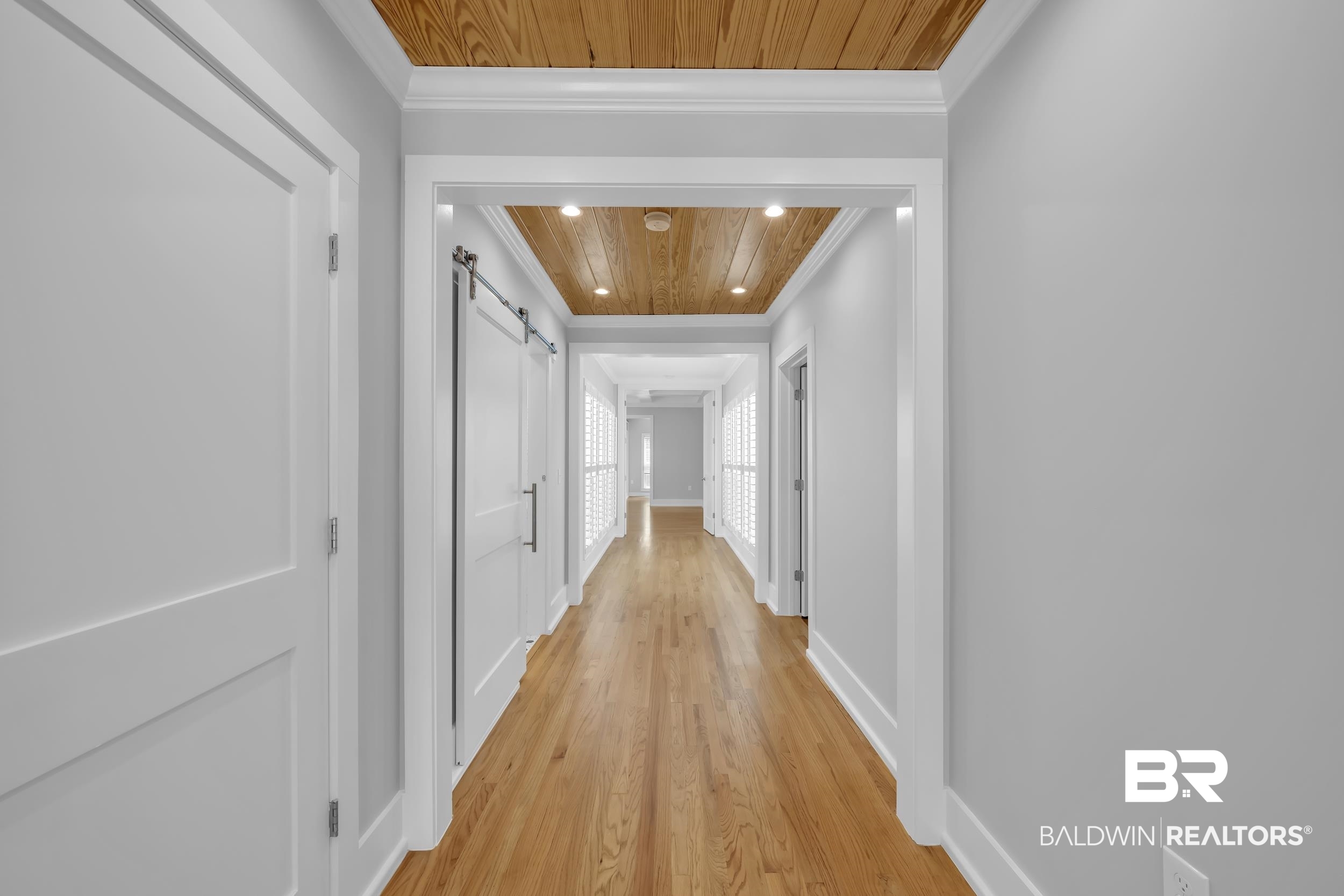 43199 Pine Grove Road Bay Minette, AL 36507 - Photo 39 of 71 Hallway featuring wood-finish flooring, recessed lighting, and a wood-paneled ceiling