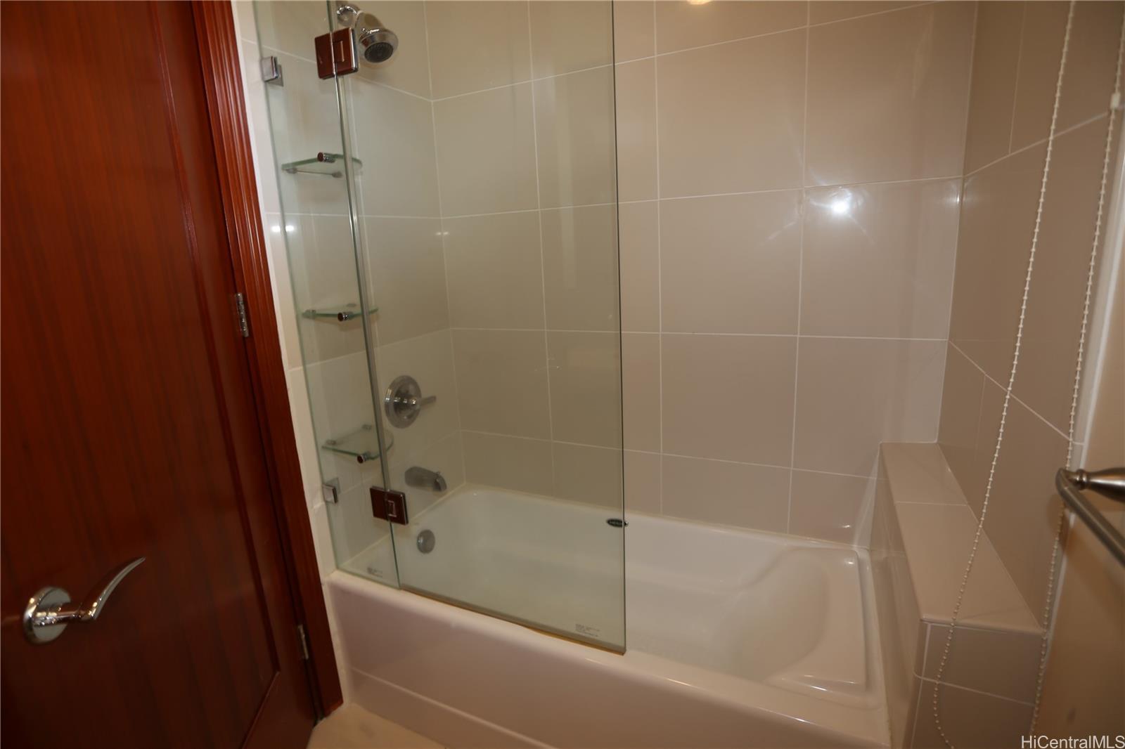 427 Launiu Street, Unit 403 Honolulu, HI 96815 - Photo 12 of 20 a bathroom with a bathtub and a shower