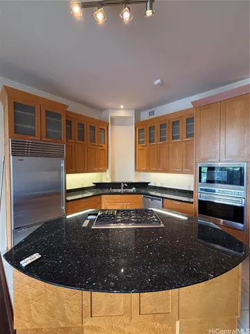 a view of a swimming pool with a patio and a yard