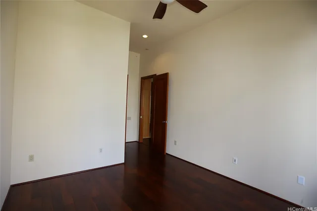 an empty room with wooden floor