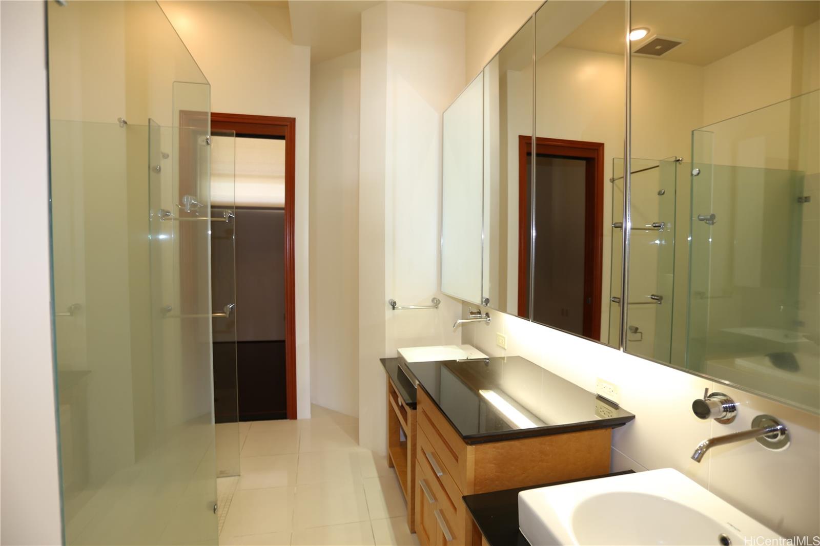 427 Launiu Street, Unit 403 Honolulu, HI 96815 - Photo 8 of 20 a bathroom with a sink and a mirror