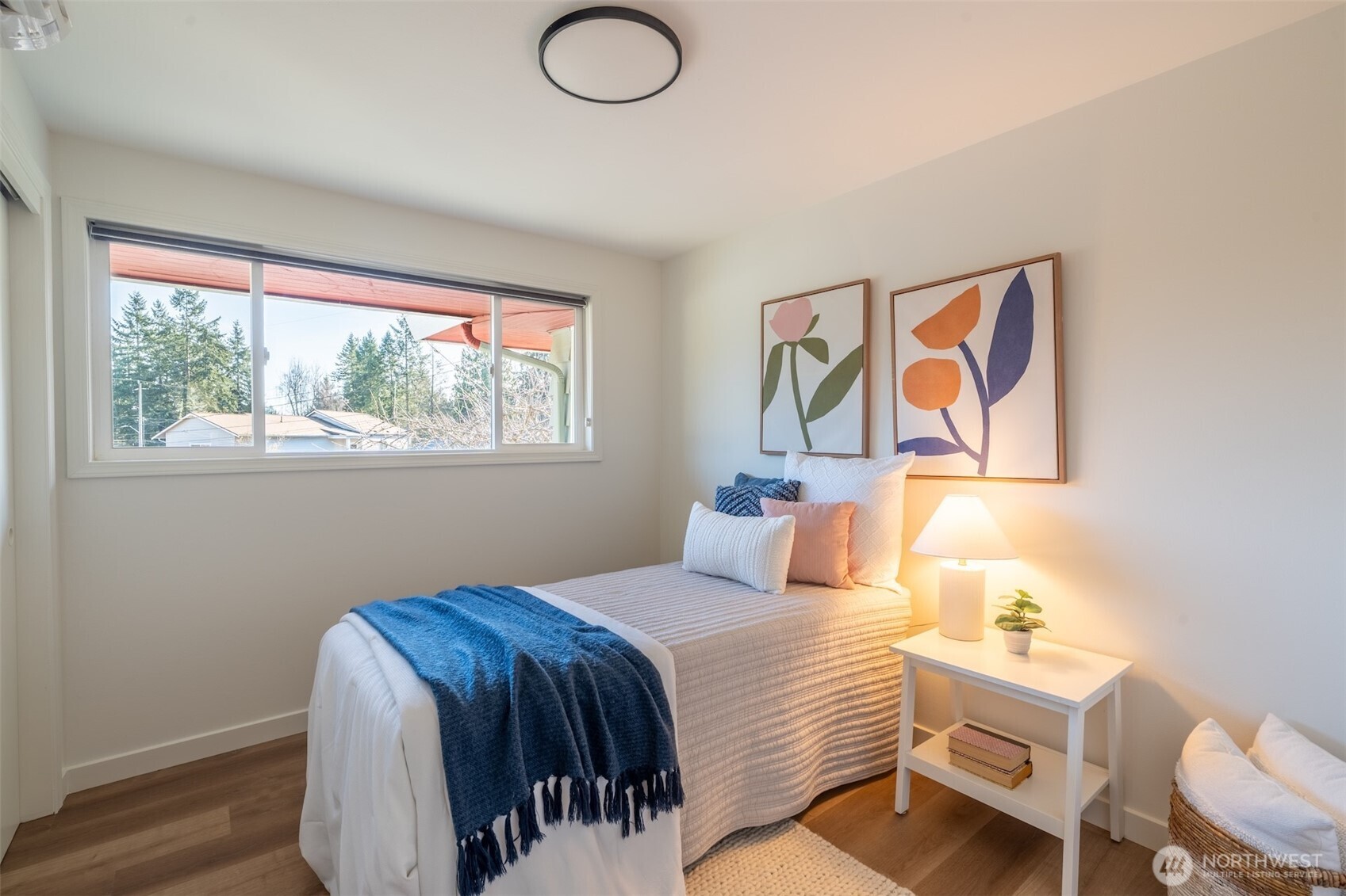 1040 Northeast 154th Street Shoreline, WA 98155 - Photo 11 of 25 a bedroom with a bed and a window