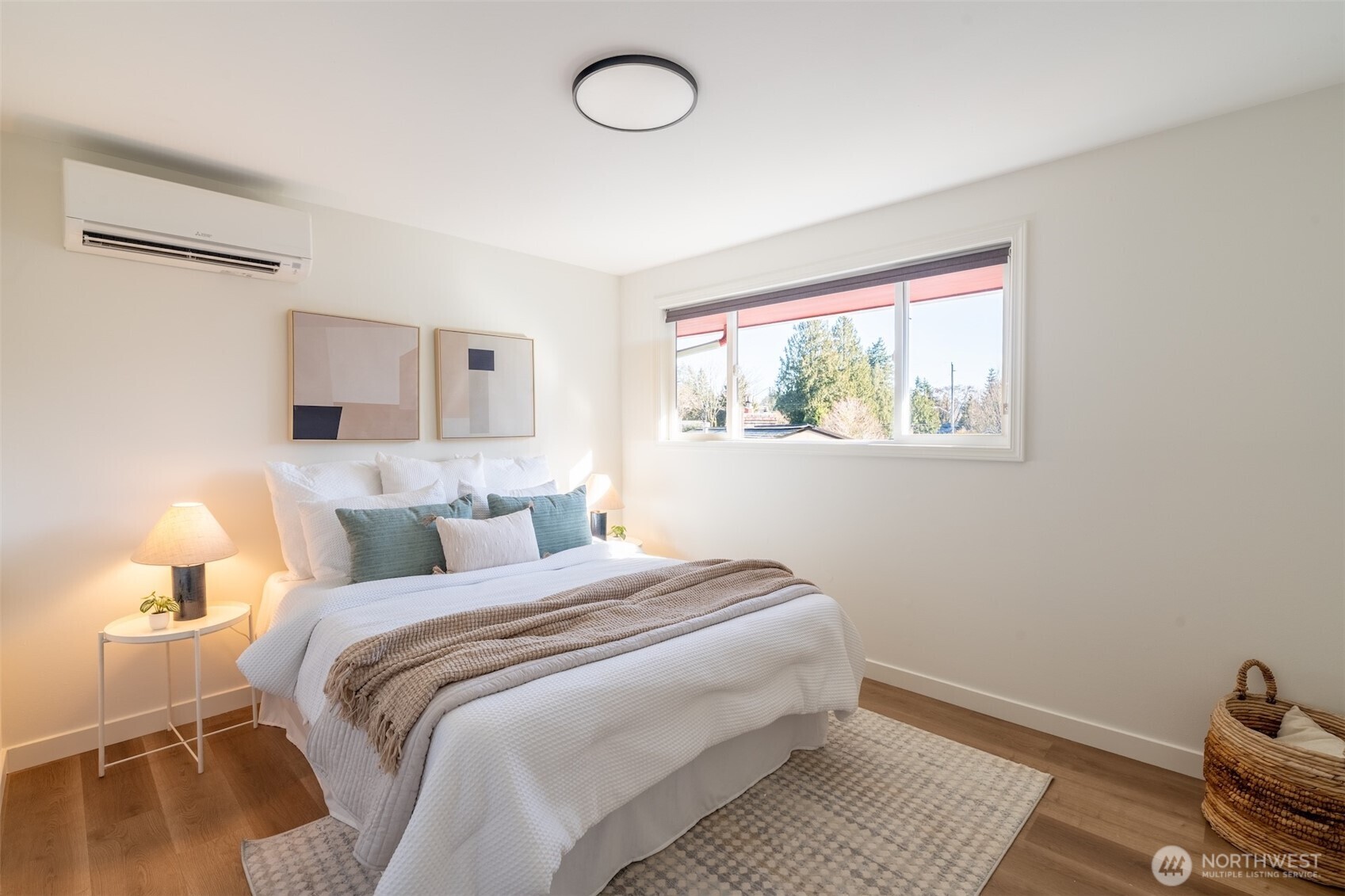 1040 Northeast 154th Street Shoreline, WA 98155 - Photo 12 of 25 a bedroom with a bed and wooden floor