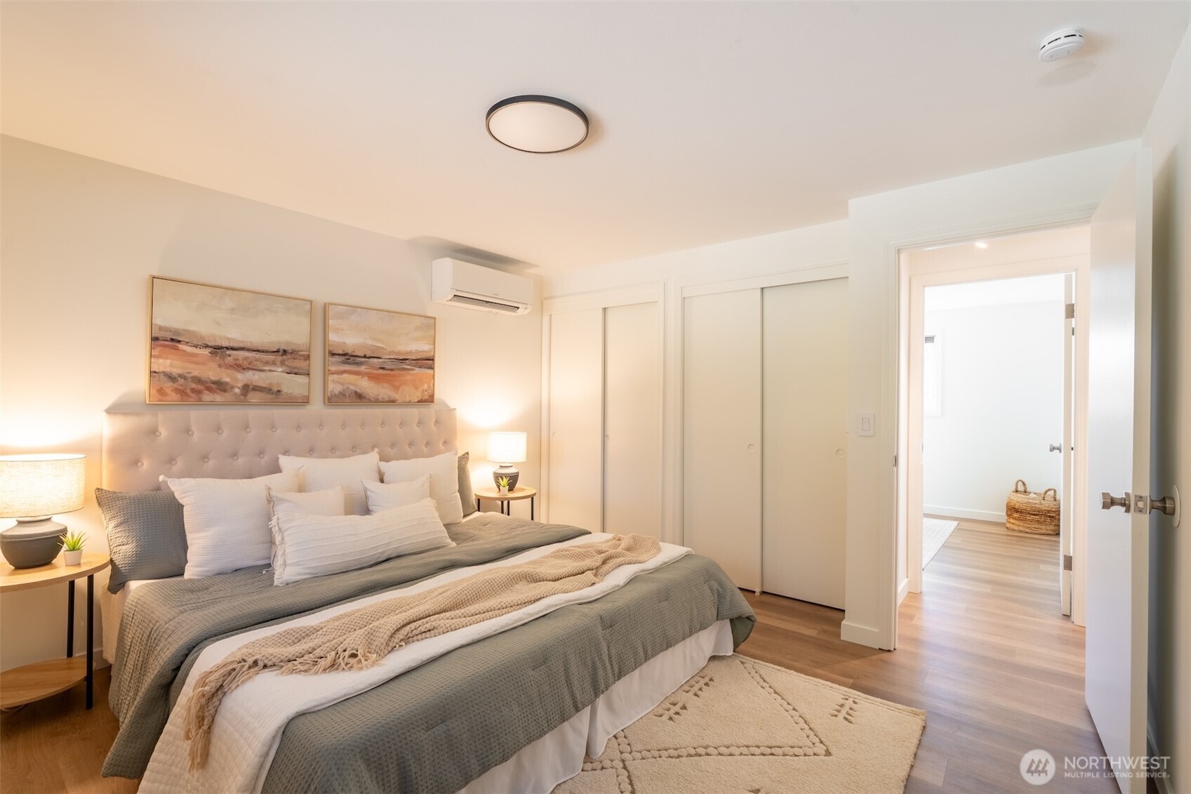 1040 Northeast 154th Street Shoreline, WA 98155 - Photo 13 of 25 a bedroom with a bed and a walk in closet