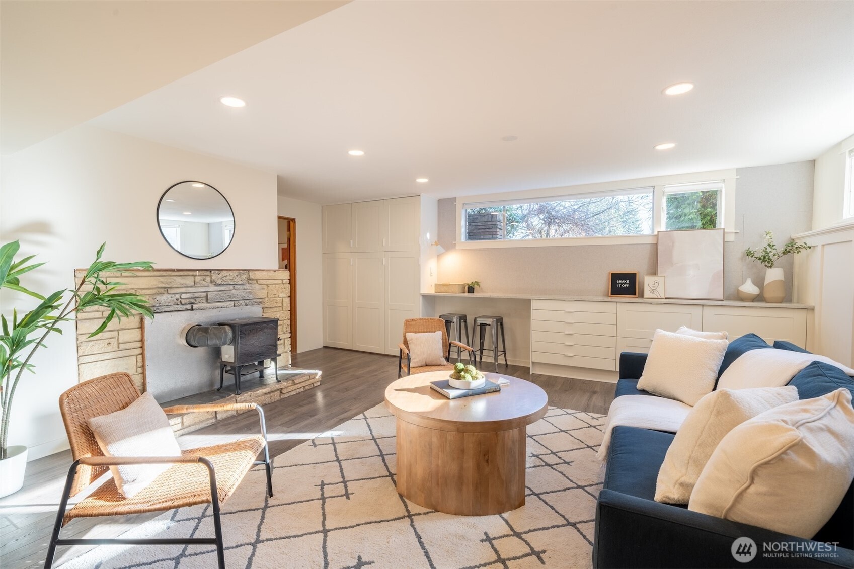 1040 Northeast 154th Street Shoreline, WA 98155 - Photo 16 of 25 a living room with furniture a fireplace and kitchen view