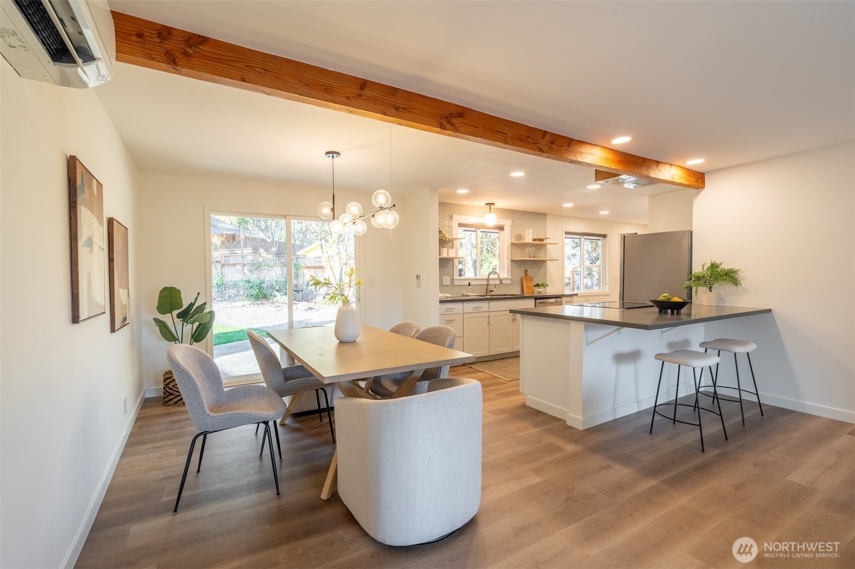 1040 Northeast 154th Street Shoreline, WA 98155 - Photo 6 of 25 a dining room with furniture and wooden floor