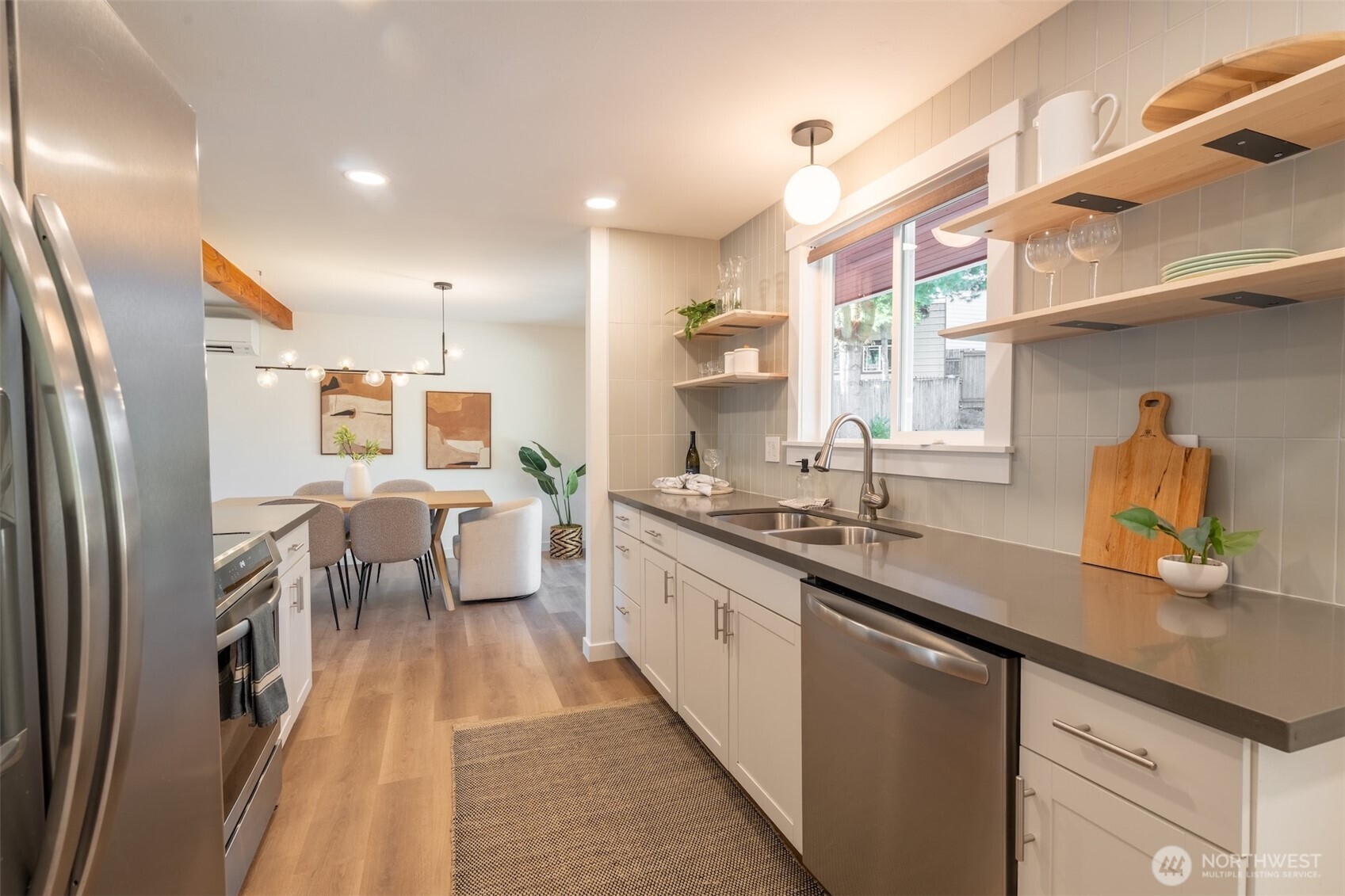 1040 Northeast 154th Street Shoreline, WA 98155 - Photo 8 of 25 a large kitchen with stainless steel appliances lots of counter space and breakfast area