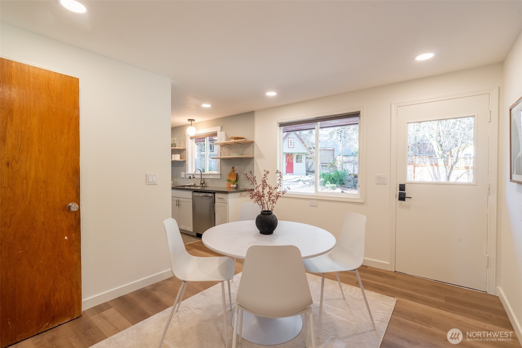 1040 Northeast 154th Street Shoreline, WA 98155 - Photo 9 of 25 a kitchen with a table and chairs in it