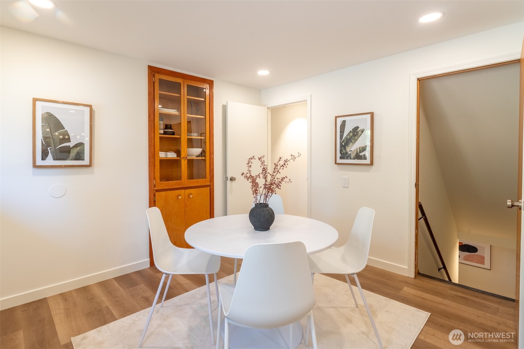 1040 Northeast 154th Street Shoreline, WA 98155 - Photo 10 of 25 a view of a dining room with furniture and wooden floor