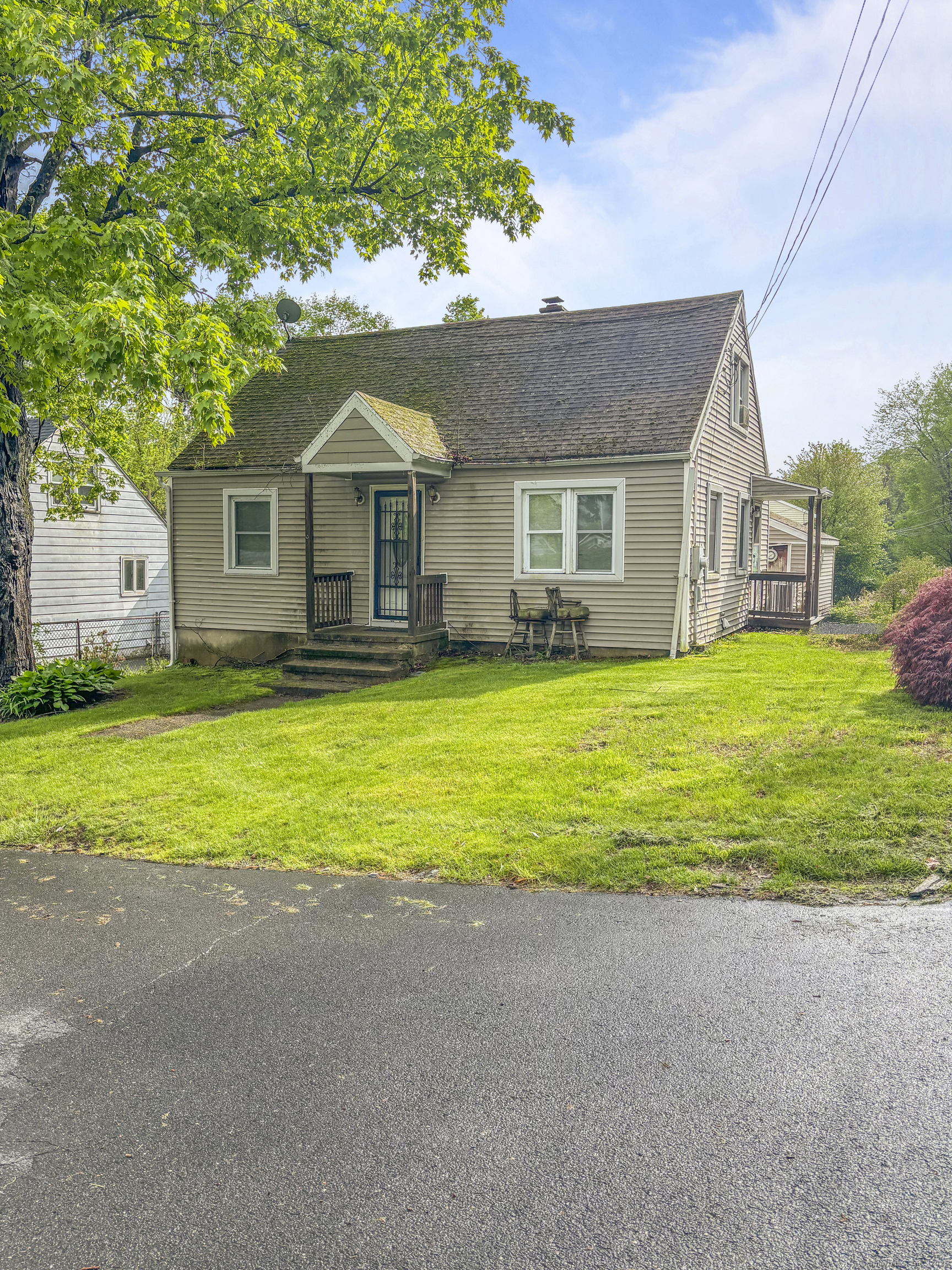 6 Peach Street Waterbury, CT 06708 - Photo 1 of 28 a front view of house with yard and green space