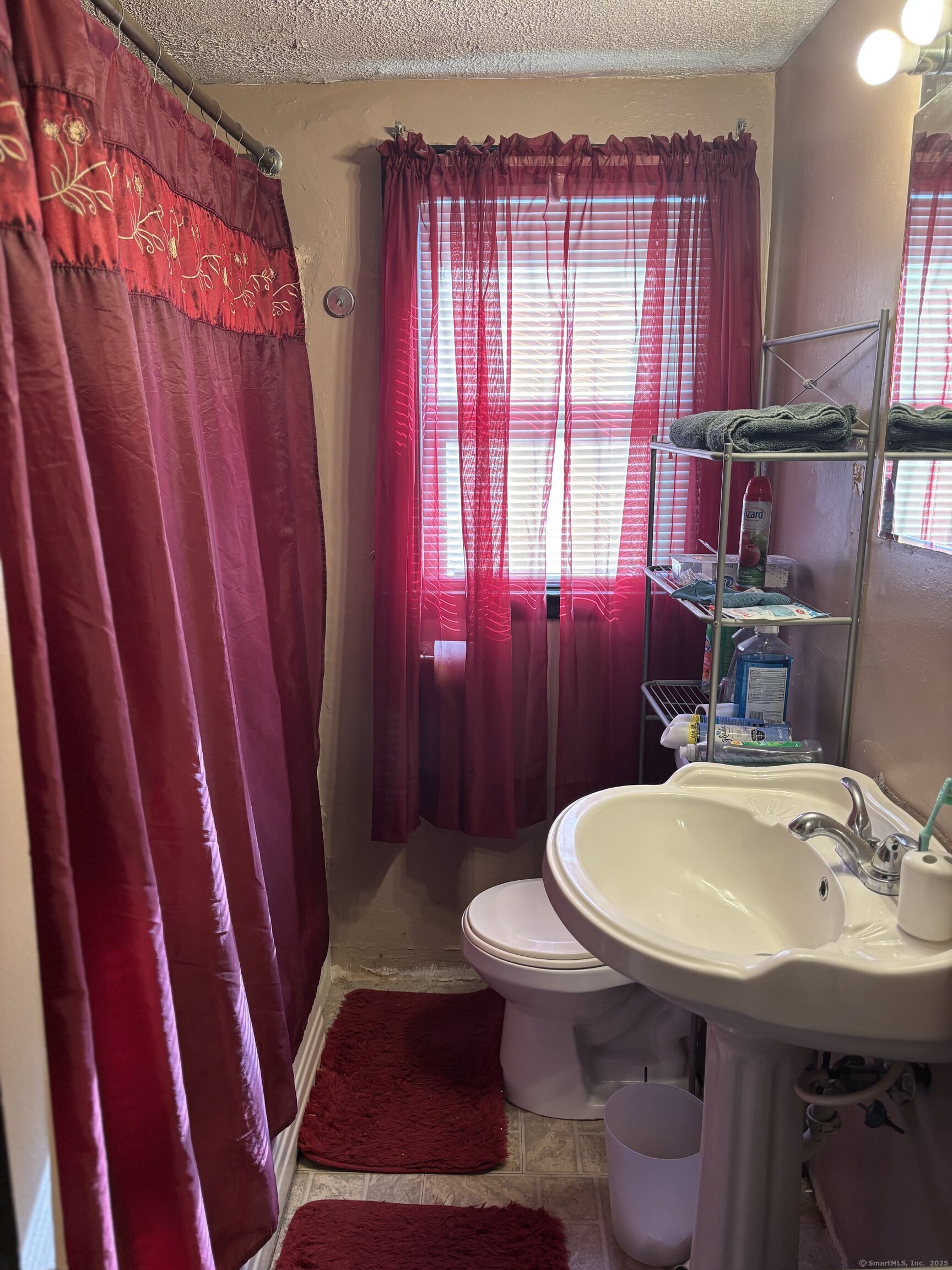 6 Peach Street Waterbury, CT 06708 - Photo 16 of 28 a bathroom with a sink a toilet a mirror and tub