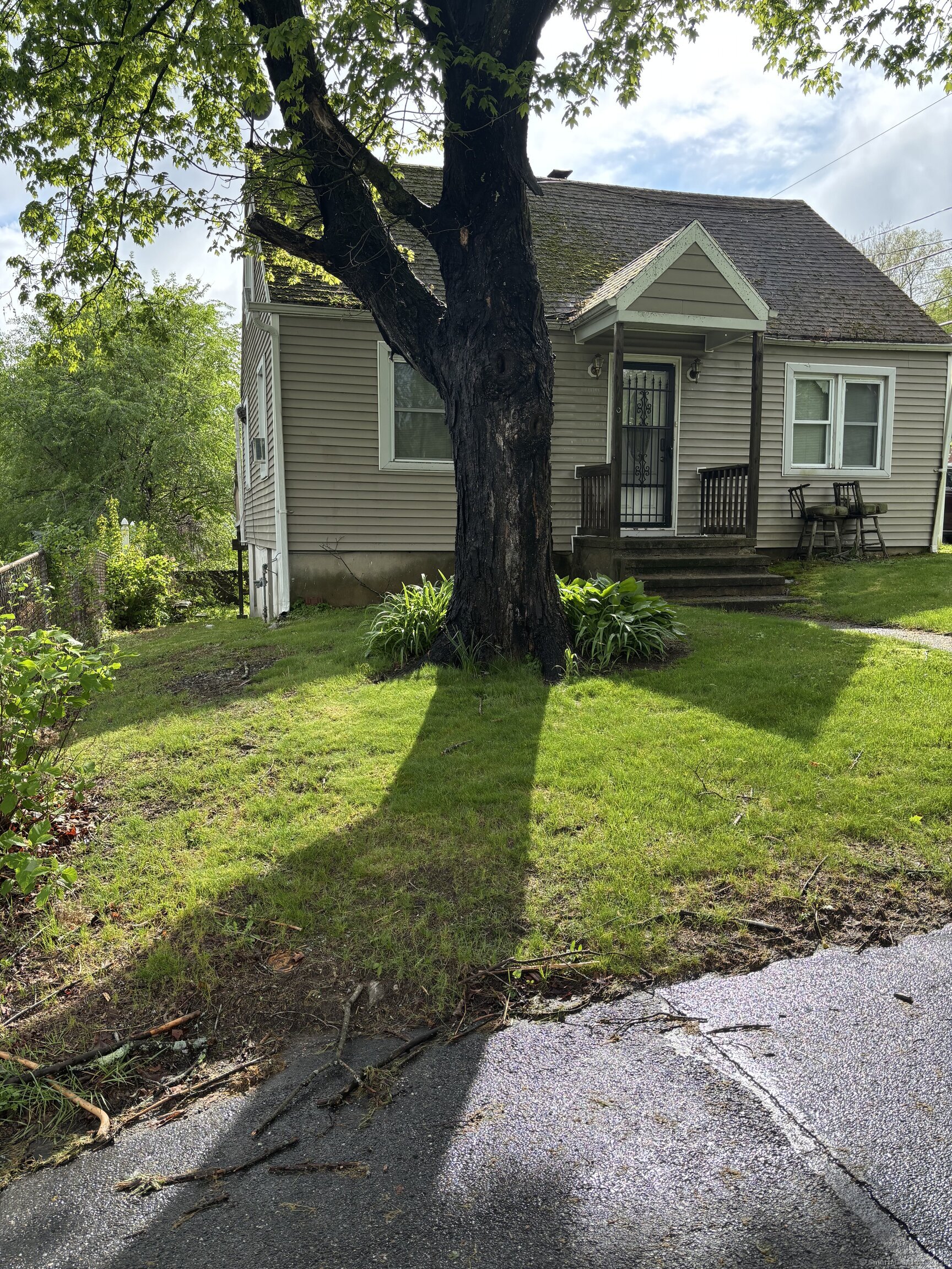 6 Peach Street Waterbury, CT 06708 - Photo 25 of 28 front view of a house with a yard
