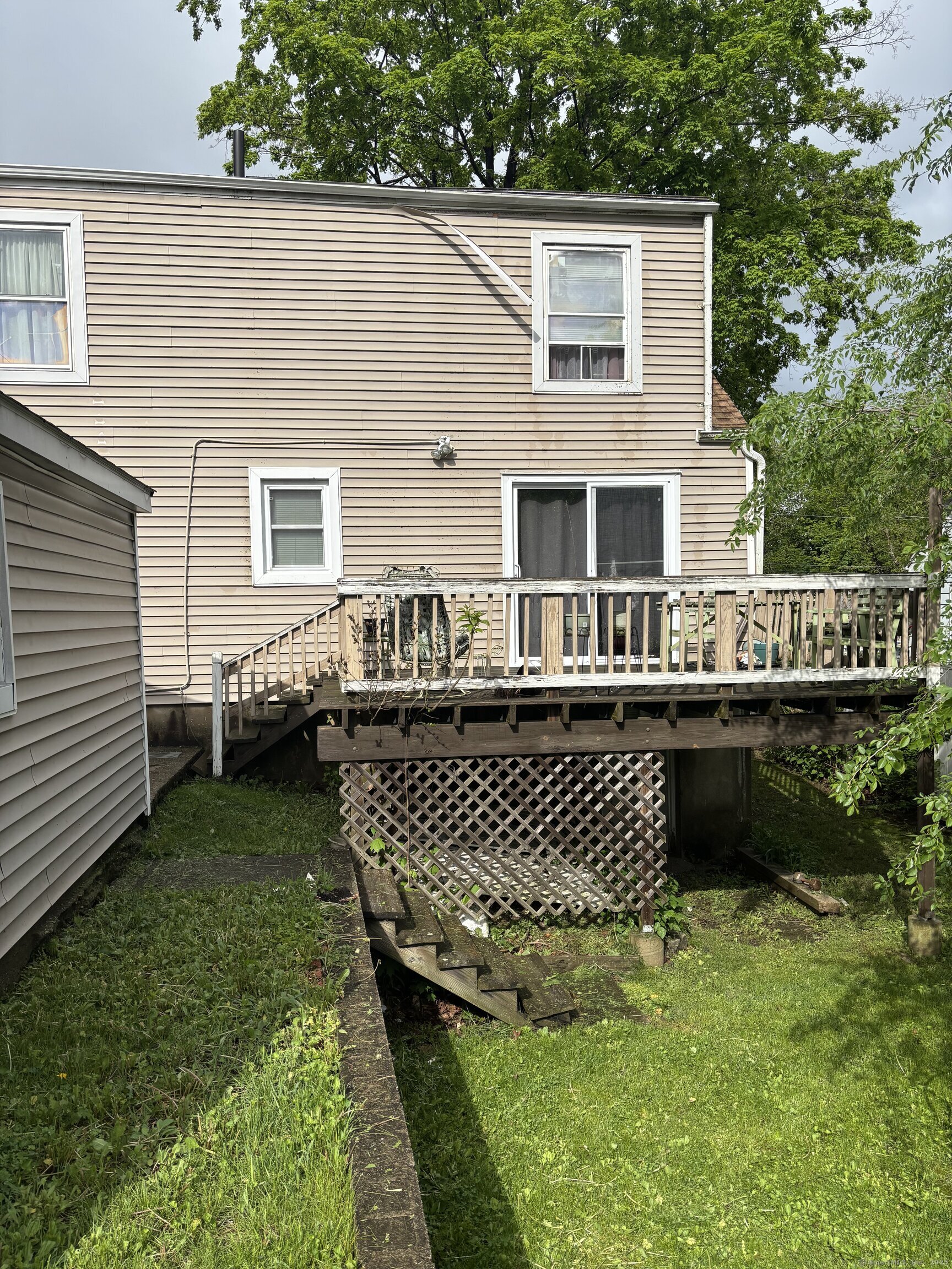 6 Peach Street Waterbury, CT 06708 - Photo 26 of 28 a front view of a house with a garden