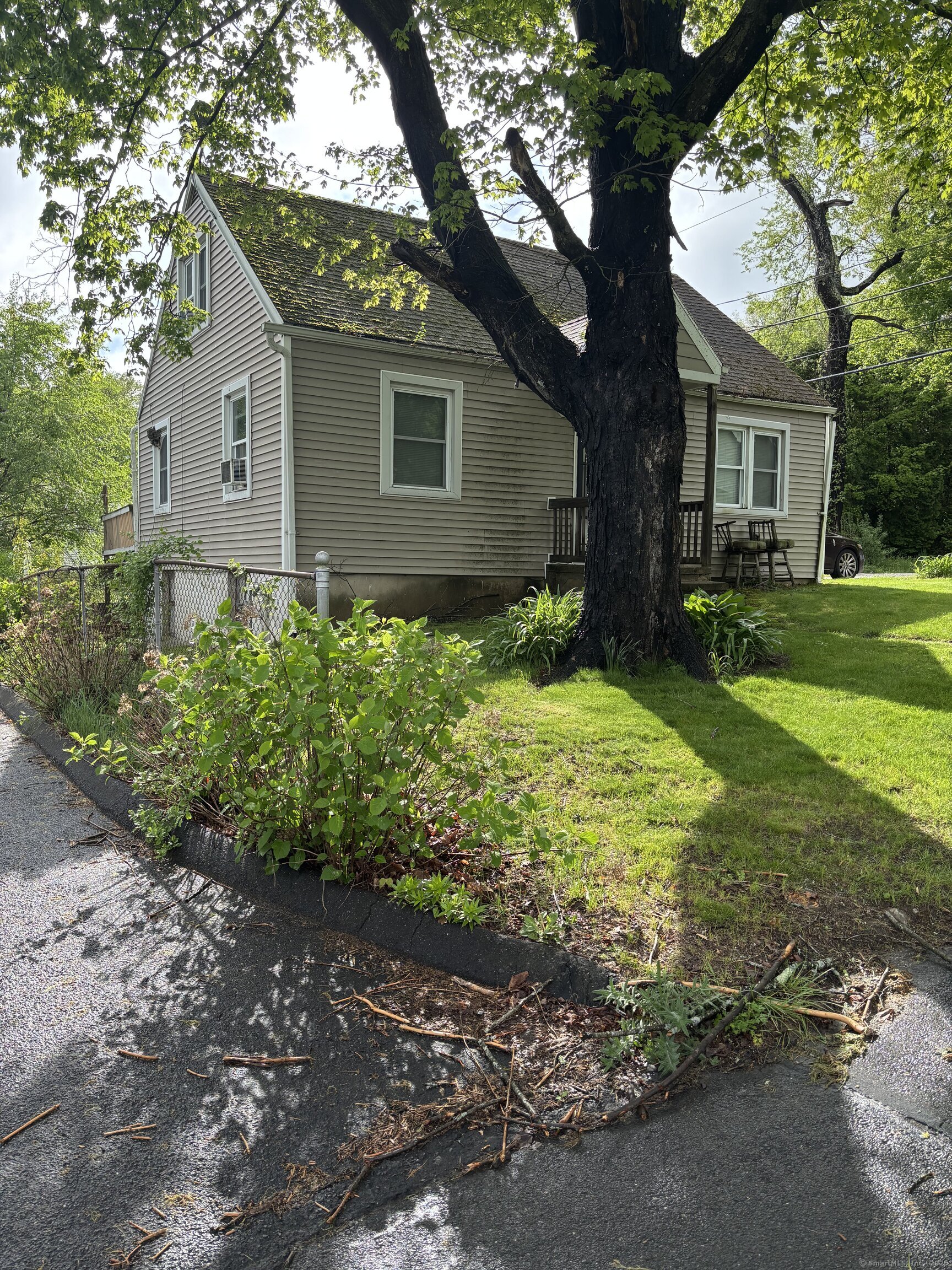 6 Peach Street Waterbury, CT 06708 - Photo 28 of 28 front view of a house with a yard