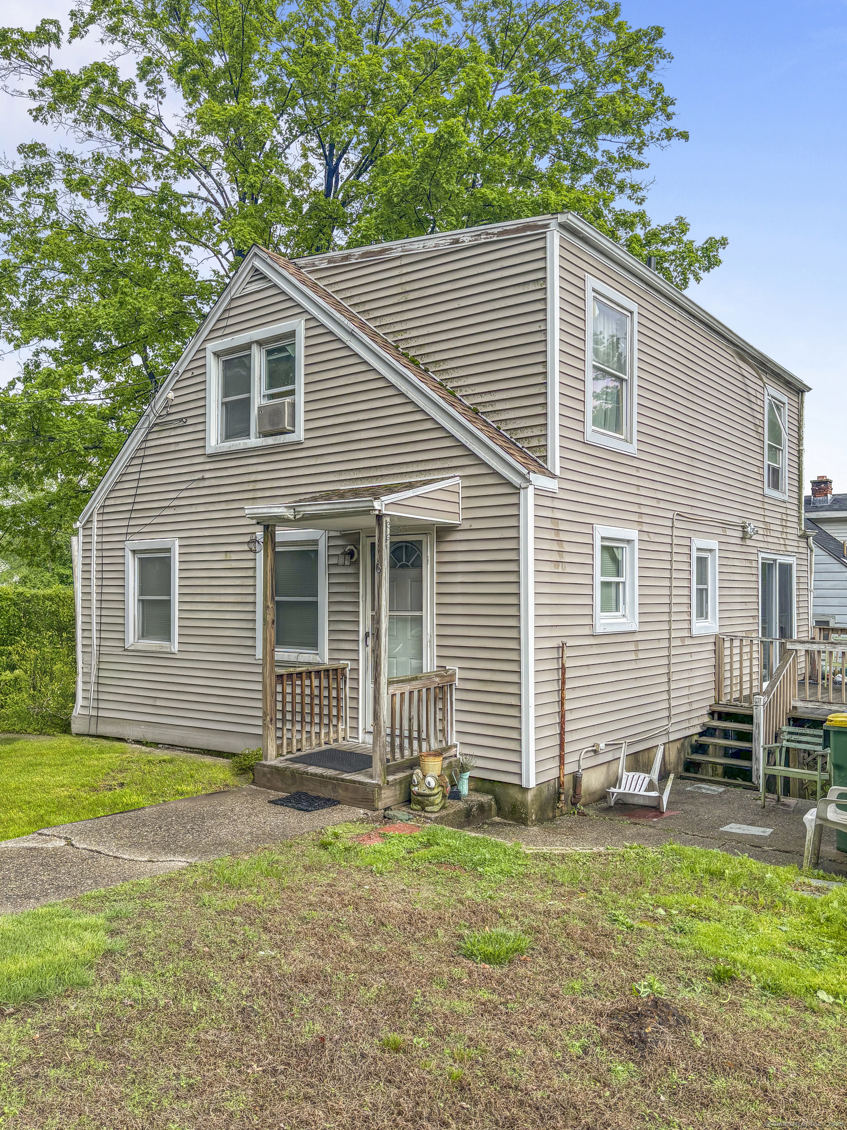 6 Peach Street Waterbury, CT 06708 - Photo 3 of 28 a front view of a house with a garden