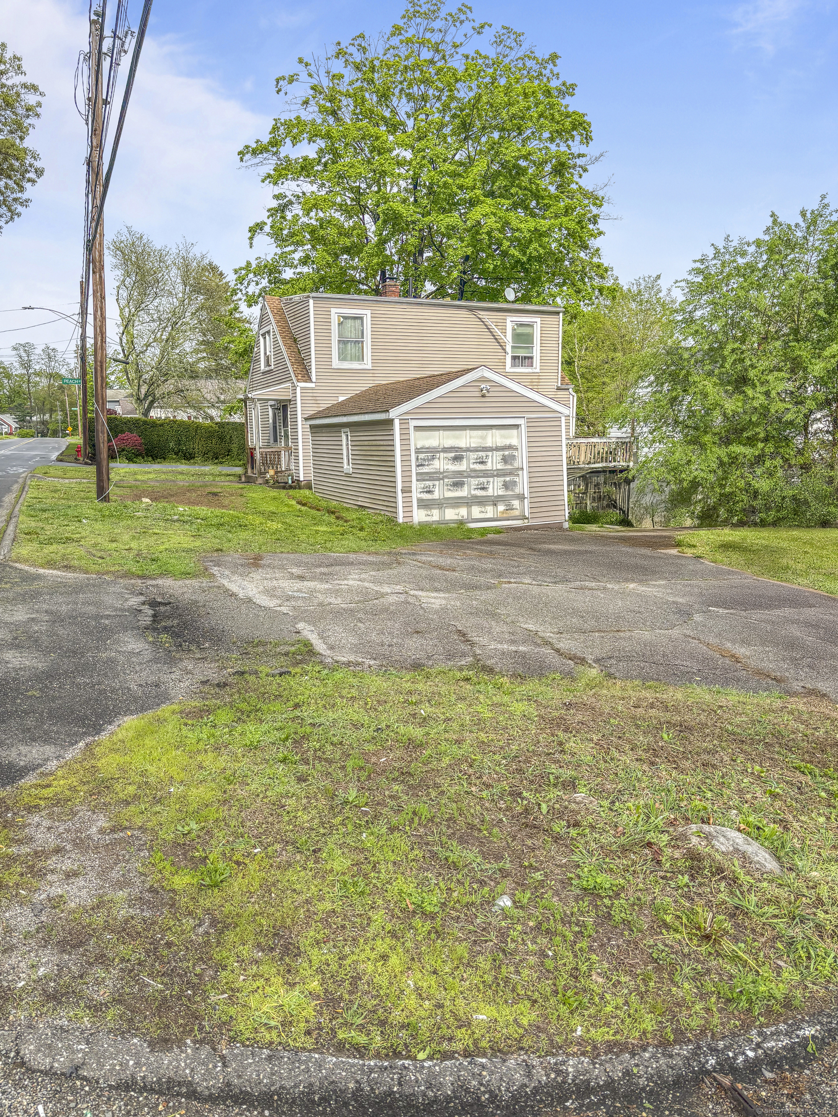 6 Peach Street Waterbury, CT 06708 - Photo 4 of 28 a front view of a house with a yard