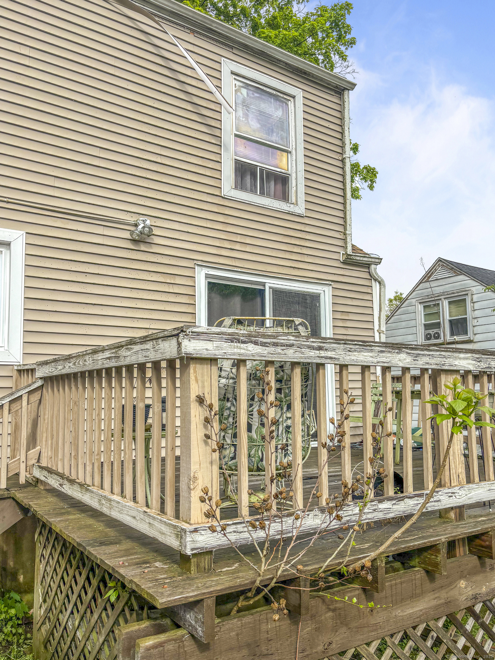 6 Peach Street Waterbury, CT 06708 - Photo 5 of 28 a view of a house with a wooden deck