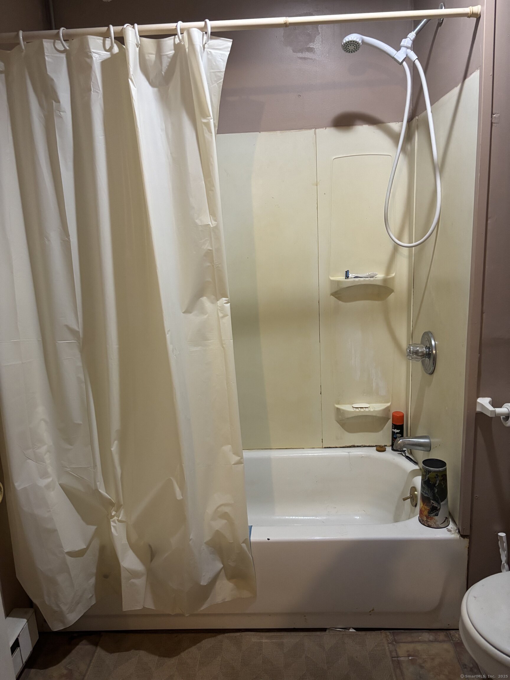6 Peach Street Waterbury, CT 06708 - Photo 10 of 28 a bathroom with a bathtub and a shower