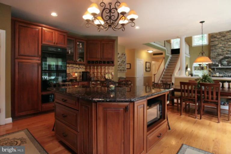 3744 Baker School House Road Manchester, MD 21102 - Photo 2 of 29 a kitchen with stainless steel appliances granite countertop a stove and a refrigerator