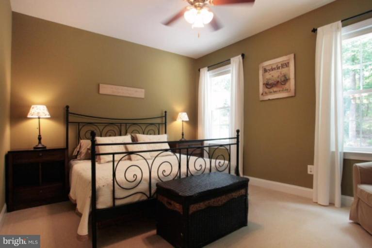3744 Baker School House Road Manchester, MD 21102 - Photo 13 of 29 a bedroom with a bed and a chandelier