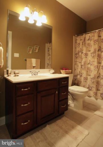 3744 Baker School House Road Manchester, MD 21102 - Photo 14 of 29 a bathroom with a sink vanity mirror and toilet