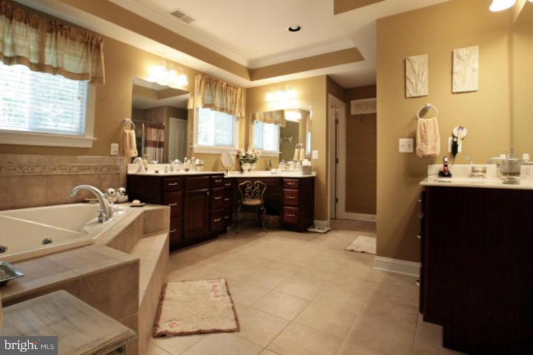 3744 Baker School House Road Manchester, MD 21102 - Photo 17 of 29 a bathroom with a tub sink and mirror