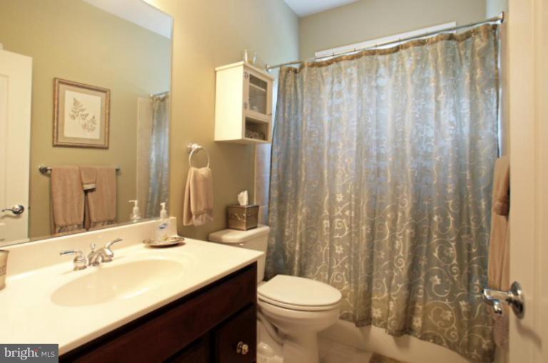 3744 Baker School House Road Manchester, MD 21102 - Photo 23 of 29 a bathroom with a sink a toilet and shower curtain