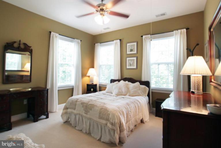 3744 Baker School House Road Manchester, MD 21102 - Photo 24 of 29 a bedroom with a bed and a chandelier