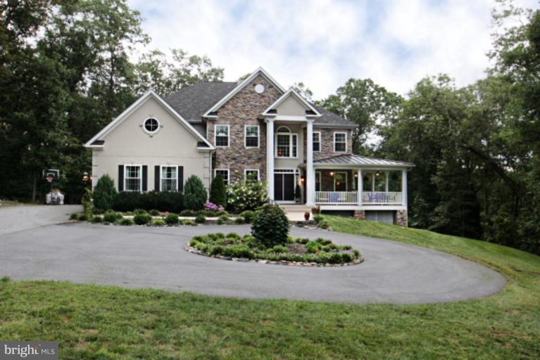 3744 Baker School House Road Manchester, MD 21102 - Photo 28 of 29 a front view of a house with a yard and porch