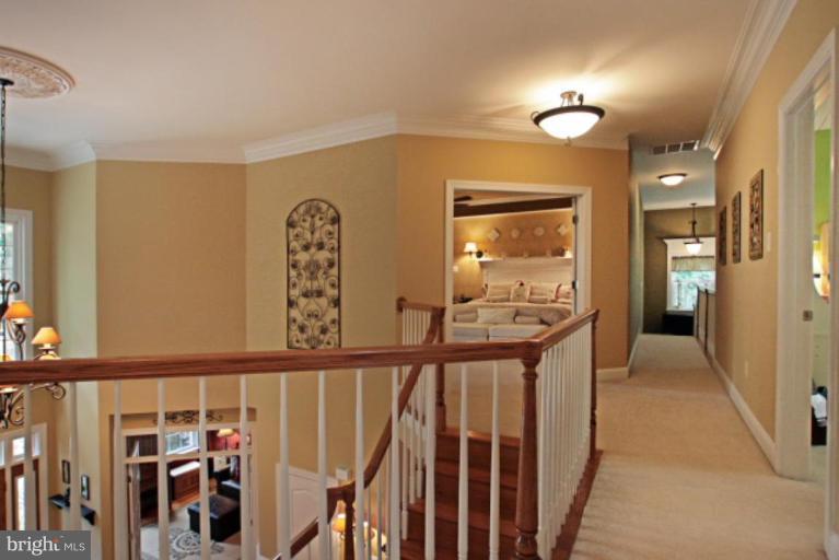 3744 Baker School House Road Manchester, MD 21102 - Photo 10 of 29 a view of a hallway to a livingroom with wooden floor and stairs