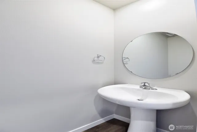 a bathroom with a sink and mirror