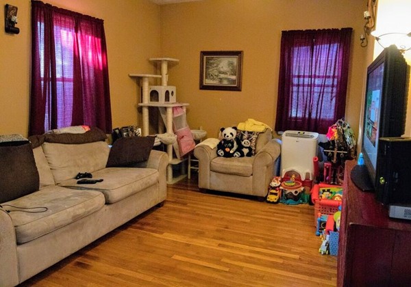185 Smith Street Fall River, MA 02721 - Photo 10 of 16 a living room with furniture fireplace and flat screen tv