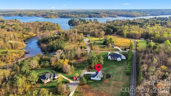 an aerial view of a houses with a yard