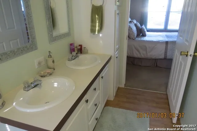 a bathroom with a sink and a mirror