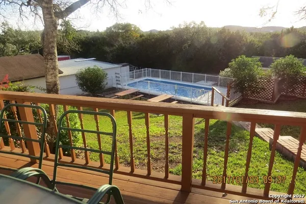 a view of swimming pool from a balcony
