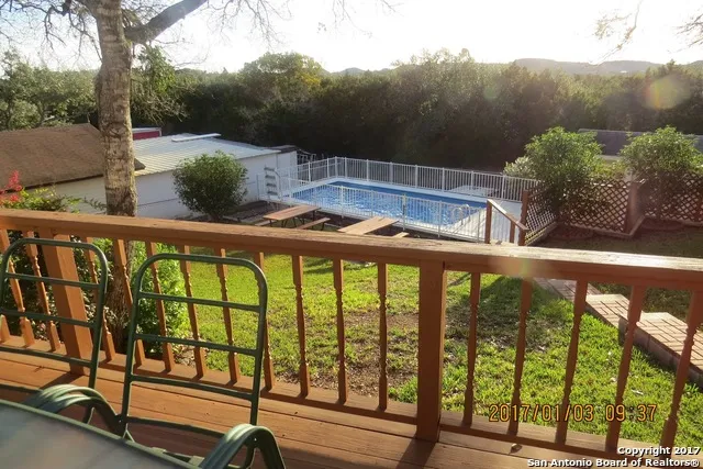 a view of swimming pool from a balcony
