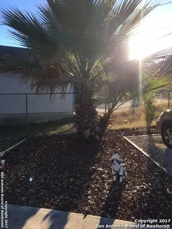 a view of a backyard of the house