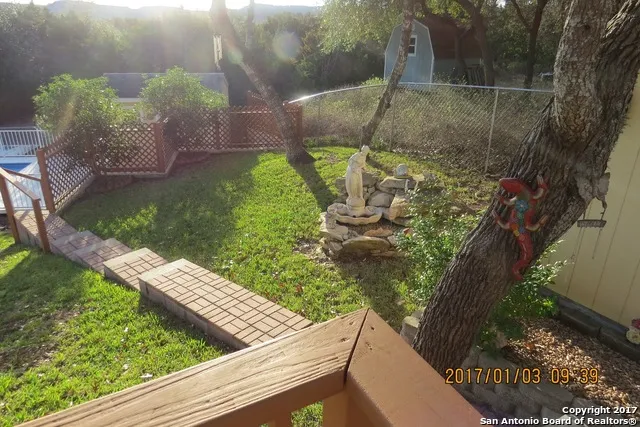 a view of a garden from a balcony