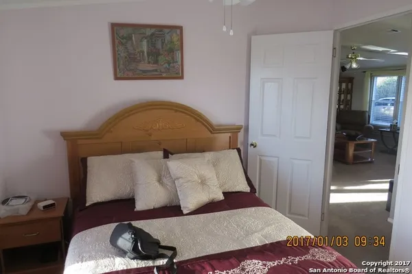 a bedroom with a bed and a walk in closet