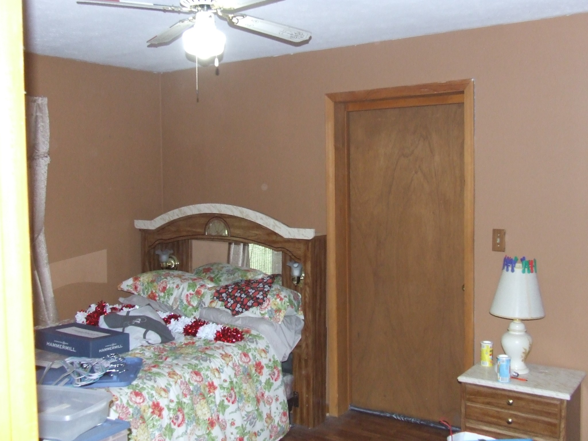 63 Sneed Road McMinnville, TN 37110 - Photo 18 of 22 a bedroom with a bed and a chandelier