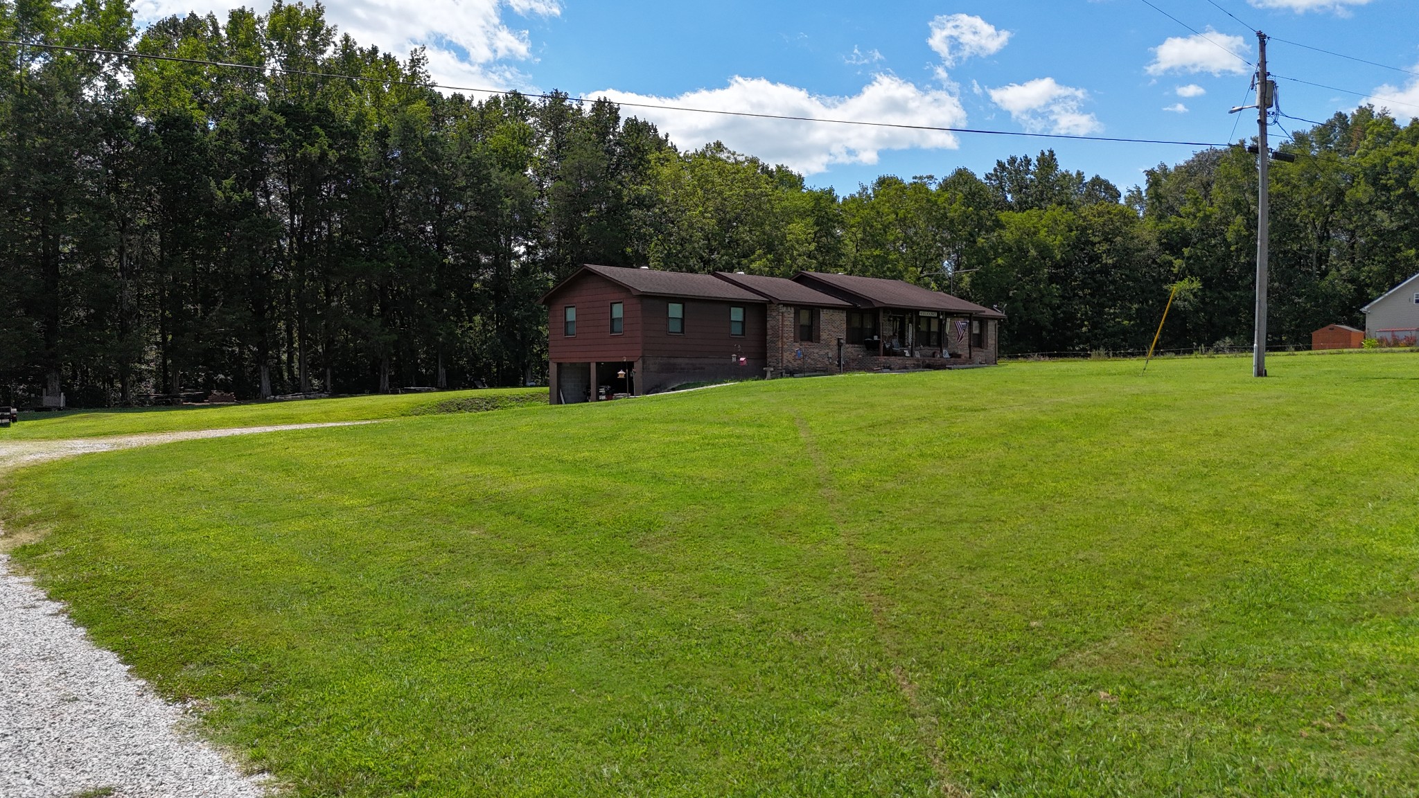 63 Sneed Road McMinnville, TN 37110 - Photo 3 of 22 a view of a big yard with plants and large trees