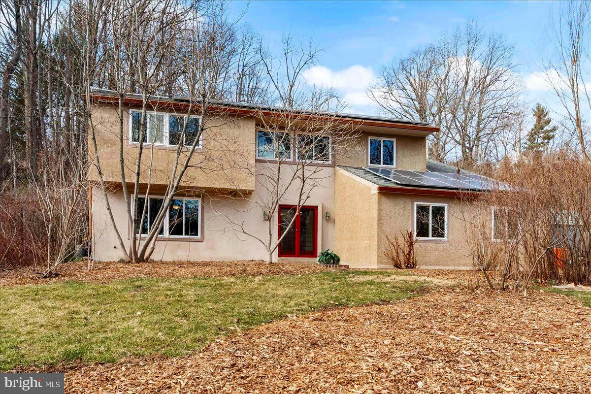 a house with trees in front of it