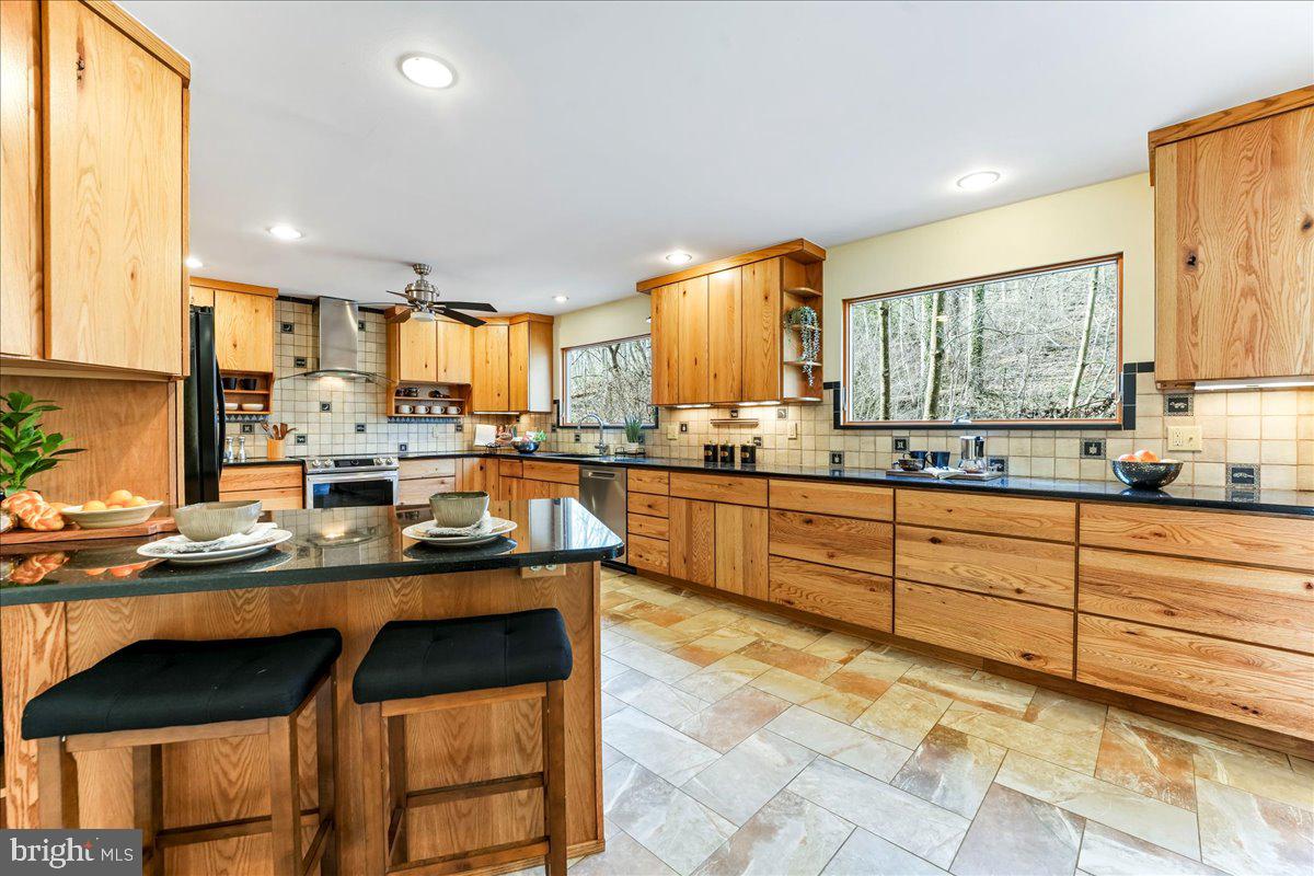 716 South Roberts Road Bryn Mawr, PA 19010 - Photo 11 of 39 a kitchen with stainless steel appliances granite countertop a stove a sink and a refrigerator