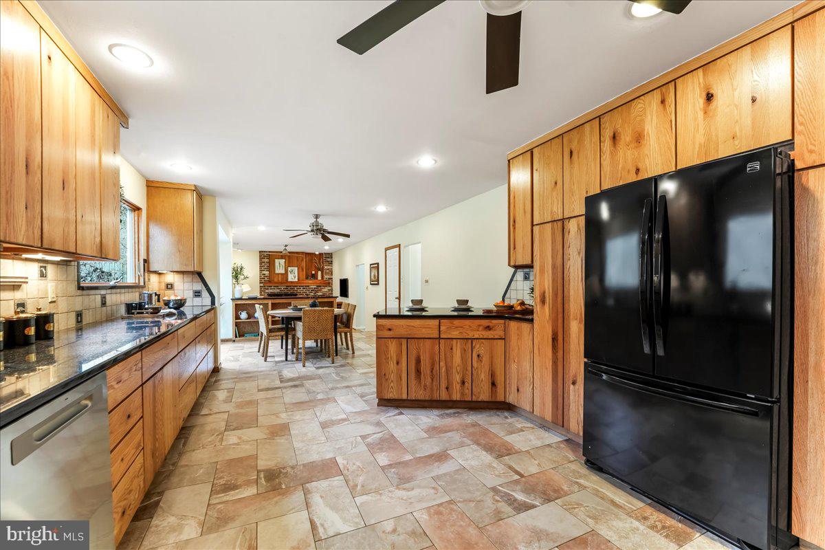 716 South Roberts Road Bryn Mawr, PA 19010 - Photo 12 of 39 a kitchen with stainless steel appliances granite countertop a refrigerator a stove and a sink with cabinets