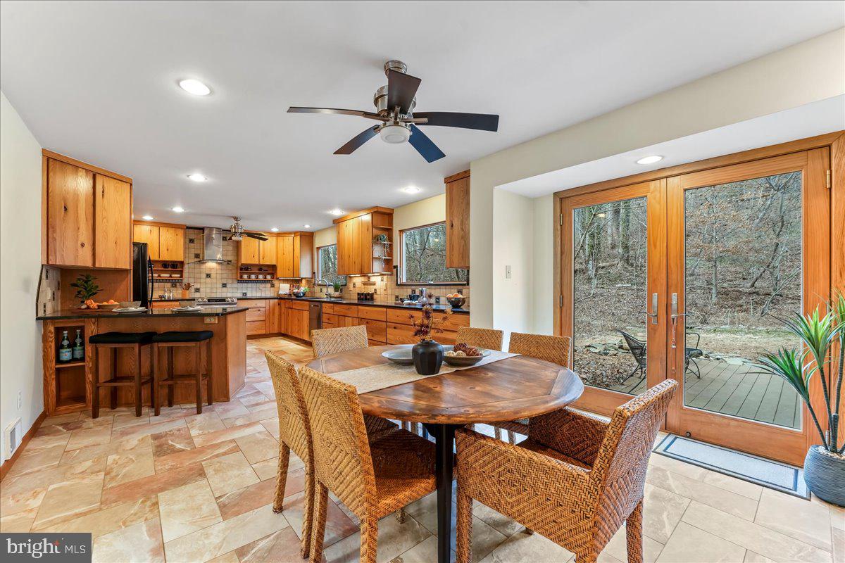 716 South Roberts Road Bryn Mawr, PA 19010 - Photo 13 of 39 a dining room with furniture and a floor to ceiling window