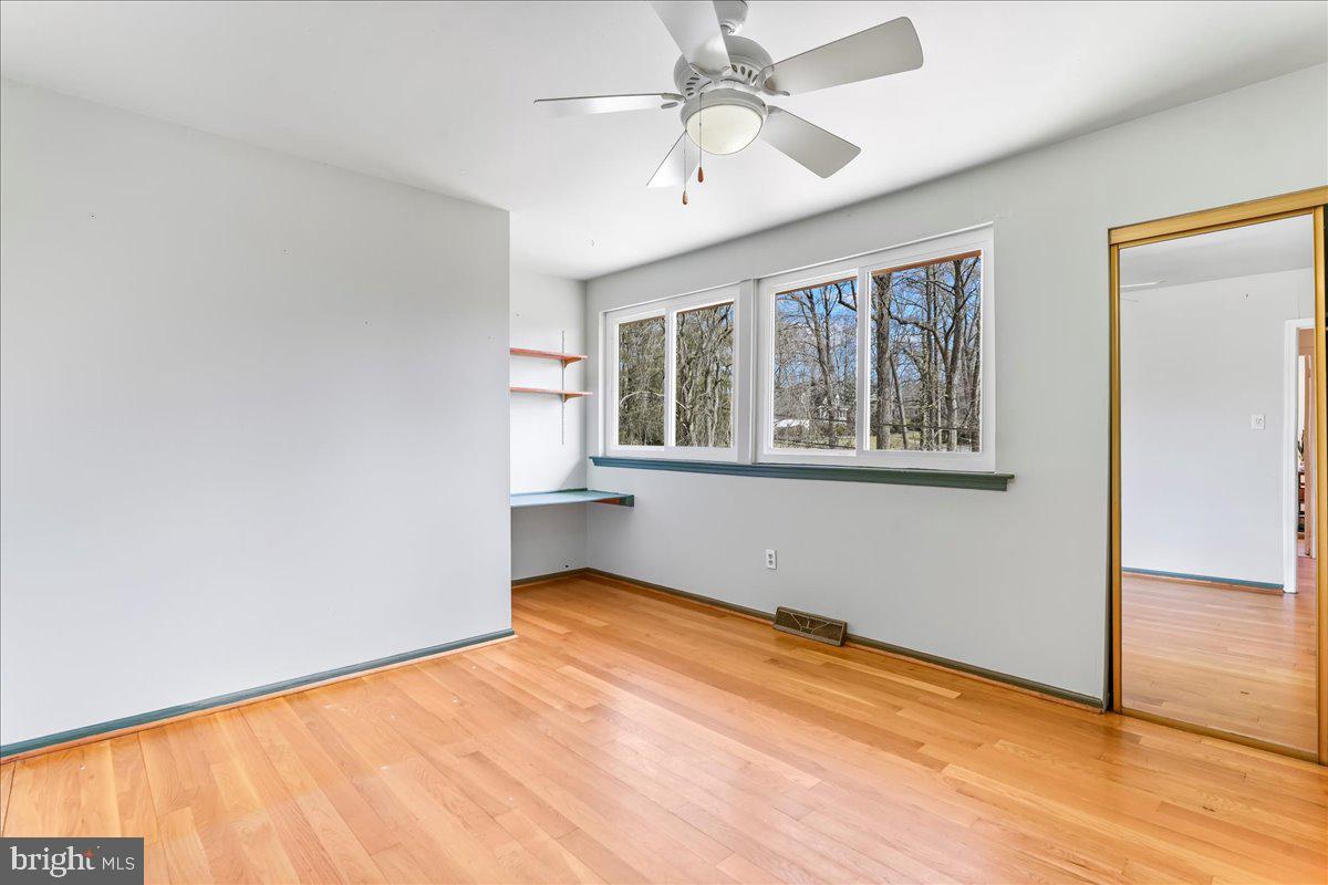 716 South Roberts Road Bryn Mawr, PA 19010 - Photo 30 of 39 an empty room with wooden floor fan and windows